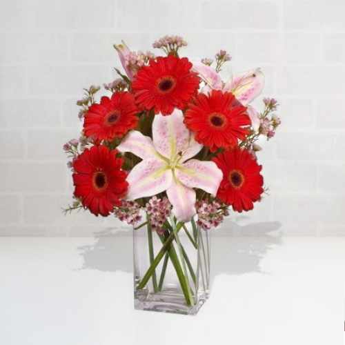 Oriental Lilies And Red Gerberas In Vase