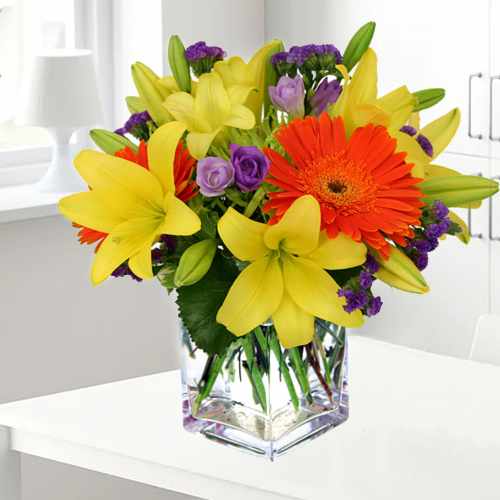 Orange Gerberas And Yellow Lilies In Vase