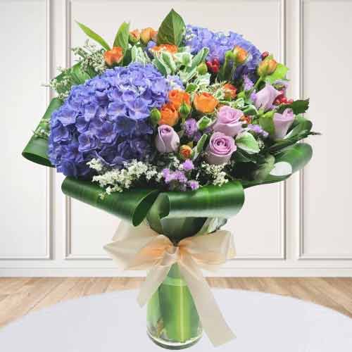Purple Hydrangea And Roses In Vase